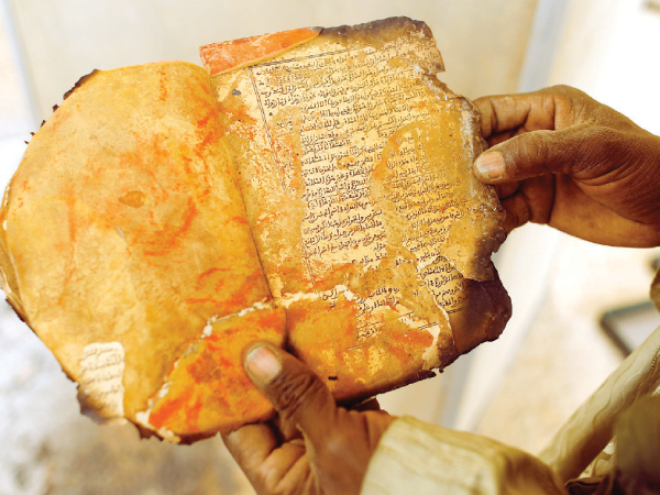 A researcher holds a copy of what might be the very first zine.