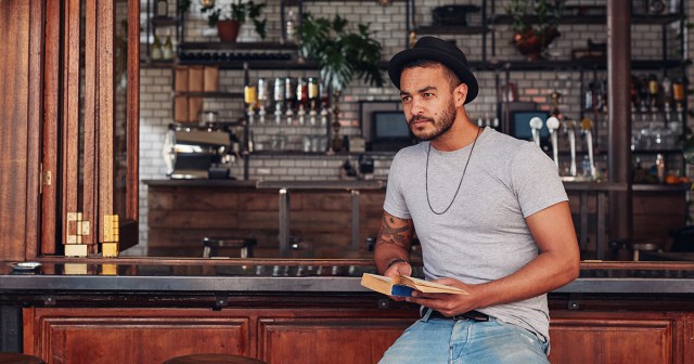 Man Reading Alone at Bar Prefers to Drink Alone at Library