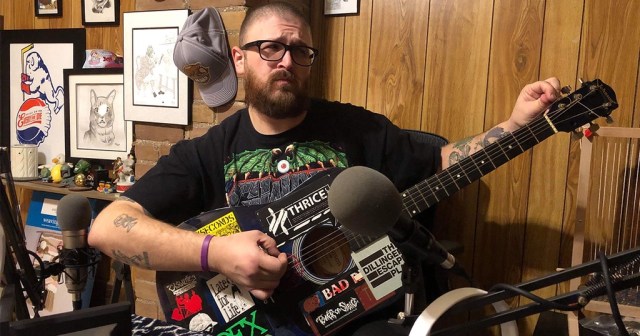 Man Tuning Guitar Also Scoring True Crime Podcast