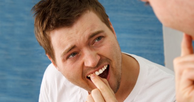 Spy Can’t Stop Playing With Cyanide Pill Tooth