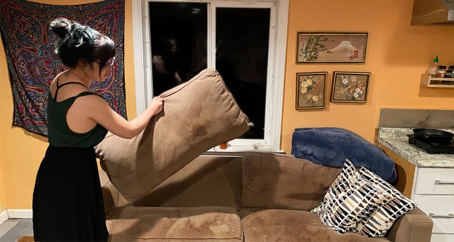 Woman Who Already Flipped Cushion Once Can’t Decide Which Stain is Worse