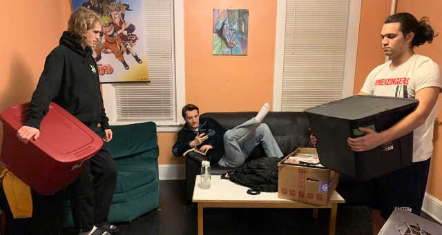 Lead Singer Sitting Back as Rest of Bandmates Help Him Move to New Apartment