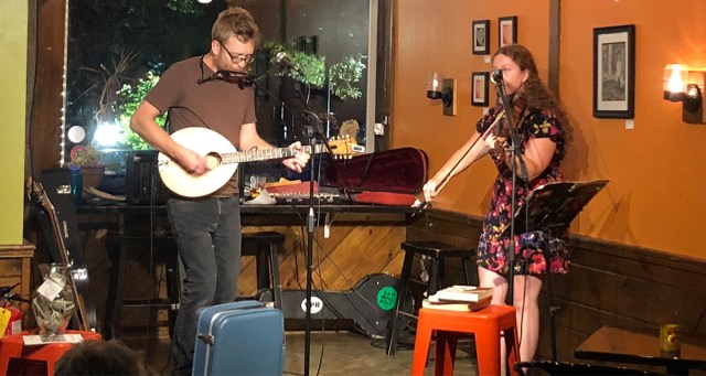 Palpable Sexual Chemistry Between Folk Duo Expressed Through Repeated Stomps on Empty Suitcase