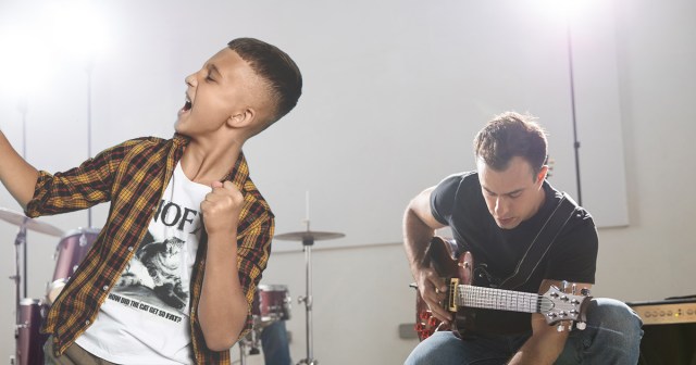 Punk Attending First Show Can’t Believe They Got to Meet Singer of Terrible Local Band That Will Break Up in Two Months