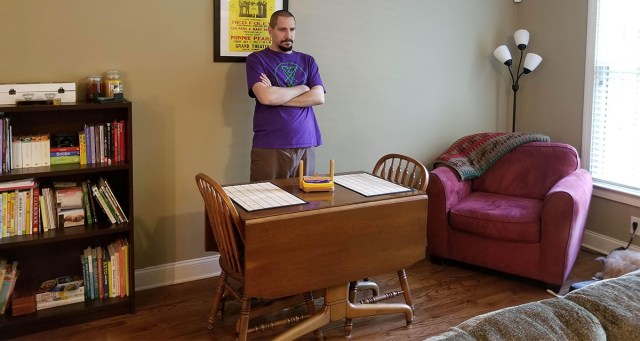 Quarantined Merch Guy Works from Home by Standing Behind Kitchen Table