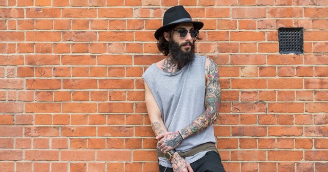 Man with Beard Keeps Back Up Personality in Hat