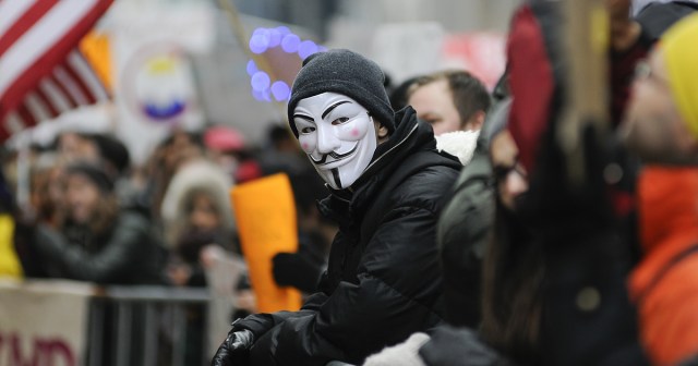 Dude Down to Protest Anything as Long as He Can Wear Cool Guy Fawkes Mask