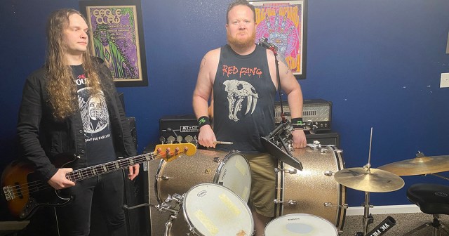 Drummer Insists on Holding Entire Kit for Band Photo