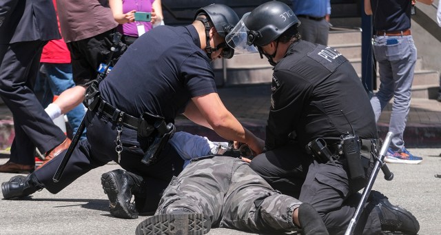 Cop Beats Protestor With Left Hand So It Feels Like Someone Else Is Doing It