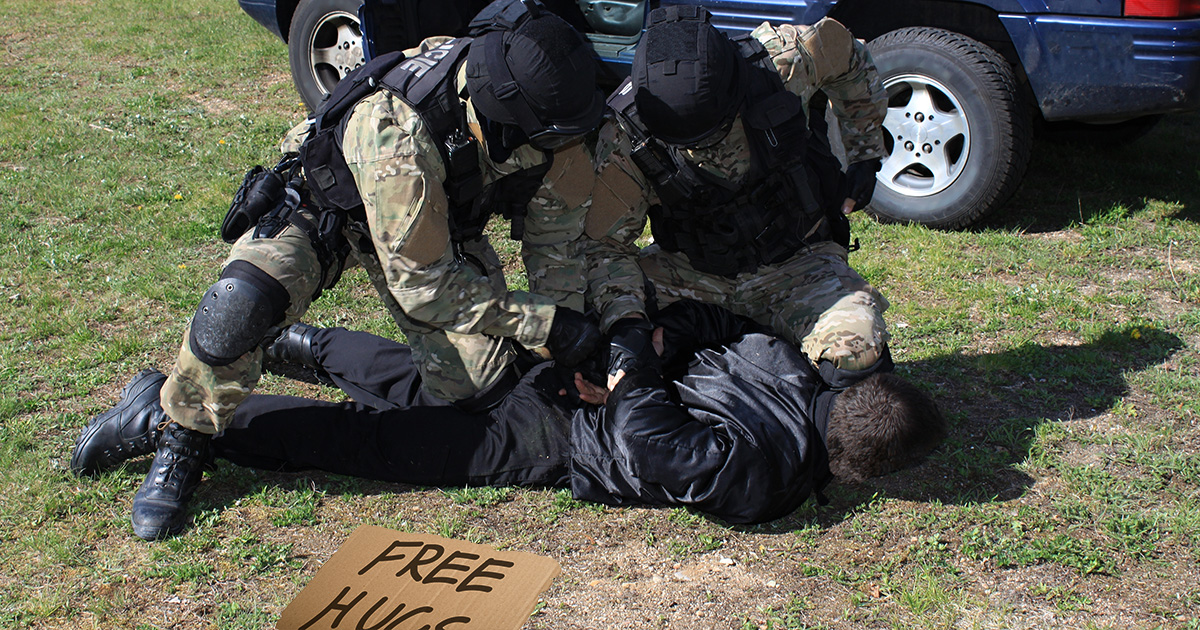 cops, police, military police, camo, free hugs, creepy, guy, violence, protest