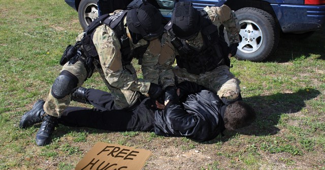 Protestors Perfectly Fine with Cops Roughing up “Free Hugs” Guy