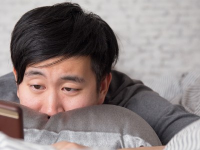 man, ready, white wall, bricks, pillow, hair, black, phone, text, call, weirdo, commitment