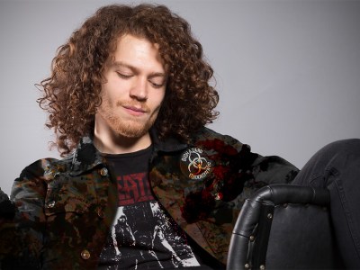 biohazard, smell, gross, vile, long hair, curly, unkept, black, denim, punk jacket, patch, sew, dirty