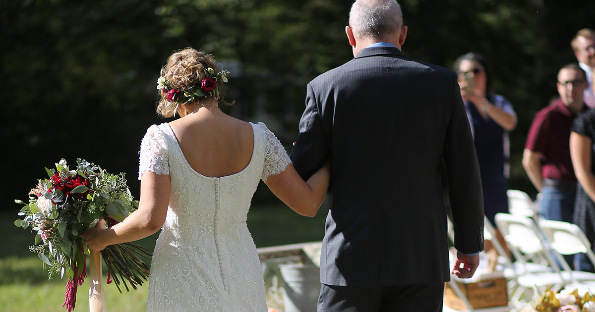 dress, white, open back, flowers, father, aisle, walk, sunny, outside, skin tone, light, white, blonde, suit, tie, fancy