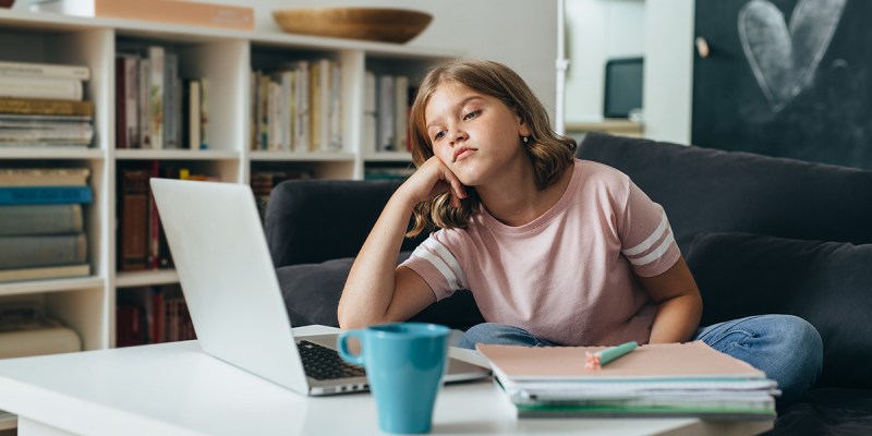 girl, cup, drink, blue, bored, computer, game, young, pink shirt, shelf, book case, macbook, chess, play, slouch