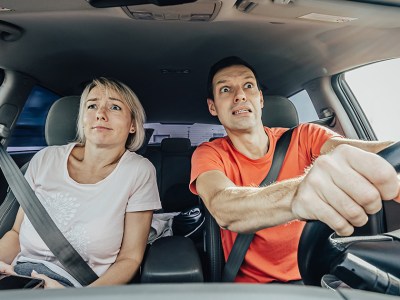 orange shirt, white shirt, man, drive, woman, passenger, scared, white knuckle, anxious, stressed, annoying, confusing, upsetting, crappy car, poor, beater, music, list, ice, ice breaker, funny, sad