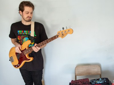 bassist, merch, sell, play, rhythm, sad, travesty, depressing, loser, demotion, job, band, member, math, calculate, stoner, loser, weirdo