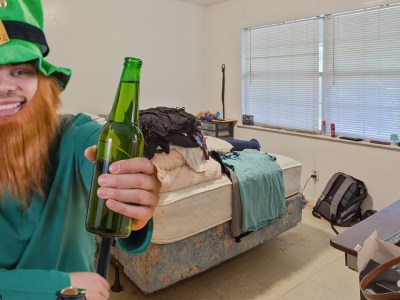 leprechaun, cute, drunk, beer, green, green hat, ginger, beard, messy room, loser, saint patrick's day, mattress, bed made, one bedroom, depressing