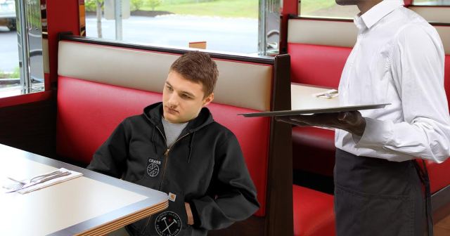 Punk in Carhartt Averts Eyes, Sinks Into Seat After Waiter Asks if Carpenter in Building Amid Wobbly Chair Emergency