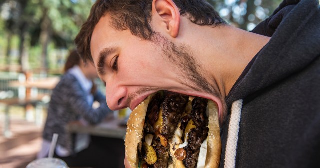 Jaw Unhinged Like Fucking Python in Order to Take Bite of Freakishly Tall, Expensive Gourmet Burger