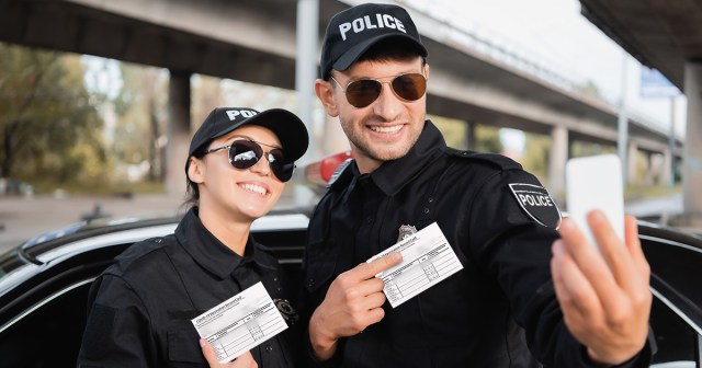 Cop Instinctively Covers Badge Number in Vaccine Selfie