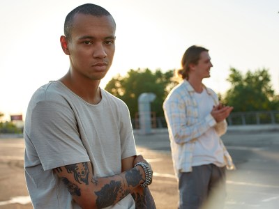 vaccine, tattoo, skin head, teeshirt, shaved head, white teeshirt, sunset, fancy, photo, dumb, stupid, misinformation, spread, Qanon, sad, bummer, depressing