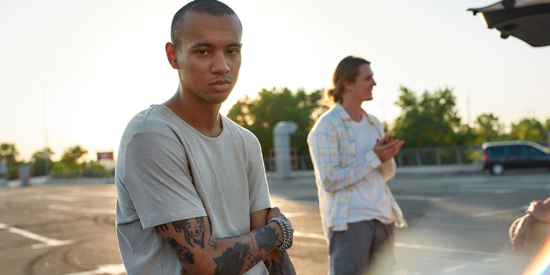 vaccine, tattoo, skin head, teeshirt, shaved head, white teeshirt, sunset, fancy, photo, dumb, stupid, misinformation, spread, Qanon, sad, bummer, depressing