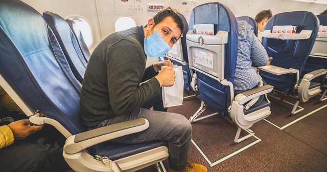 Man on Flight Unsure if It’s Against Rules to Lower Mask to Use Vomit Bag