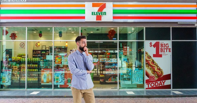 Man Slowly Caving to Ad for 7/11 Hot Dog