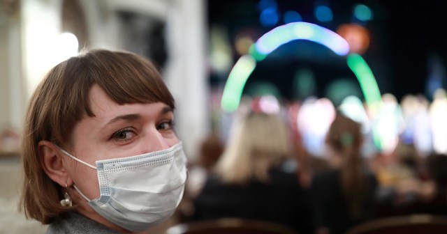 Masked Woman at Concert Relieved She Doesn’t Have to Pretend to Know The Words