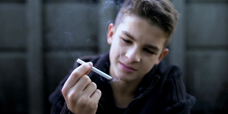 smoking cigarettes at 14 UK prime minister wants to raise the legal age to buy in England so eventually no one can Plain Black Leather Metal Cigarette