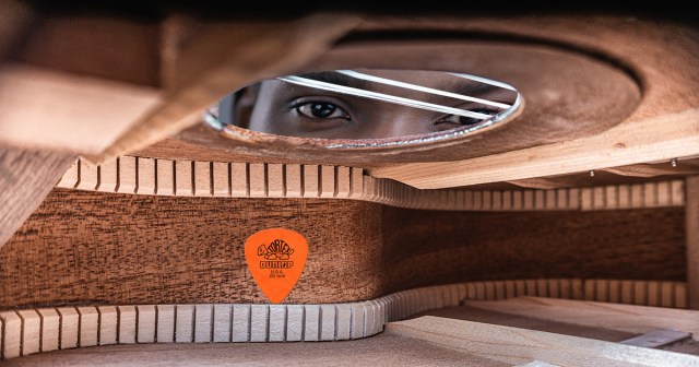 Desperate Pick Clings to Inside of Guitar in Terror