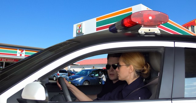 Cop Clocks in for Long, Exhausting Shift of Sitting in Parked Cruiser Outside of 7-Eleven