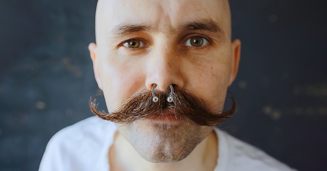 Septum Piercing Fights Handlebar Mustache for Ultimate Control of Man’s Face