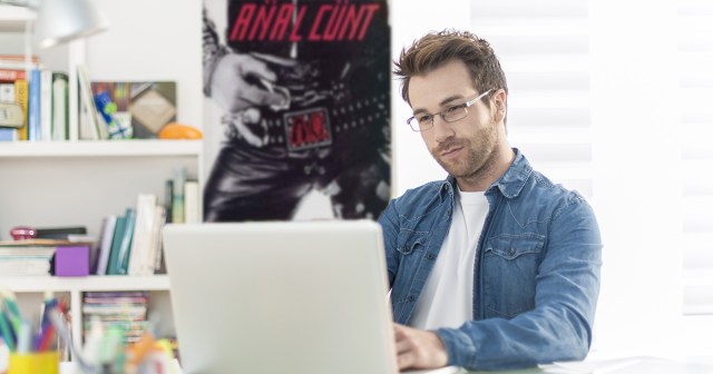 Man Fails to Hide Anal Cunt Poster in Background of Work Call