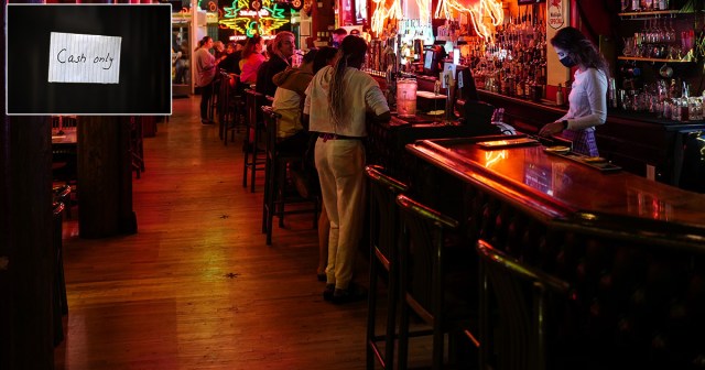 Dive Bar Clearly Displays “Cash Only” Sign on Tiny Handwritten Piece of Scrap Paper Taped to Darkest Corner of Bar