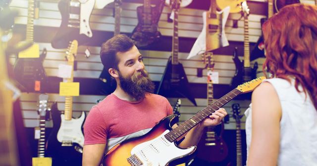 Woman Shopping at Guitar Center Blissfully Unaware She Just Became Employee’s Muse