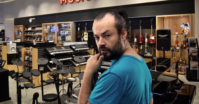 Guitar Center Employee With Tiny Ponytail Demoted to Lighting Department