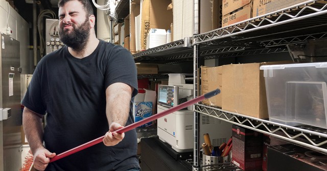 Guy Playing Air Guitar With Broom at Work Unaware How Much Rat Shit Now on His Hands