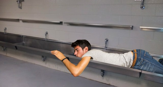 Punk Dad Feeling Nostalgic for Life Before Kids After Seeing Carefree Man Passed Out in Trough Urinal