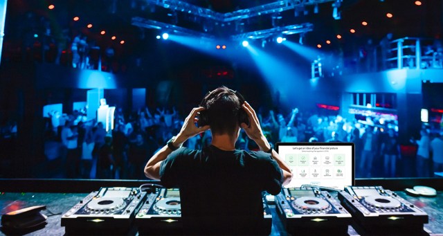 DJ Utilizes Downtime on Stage to Do His Taxes