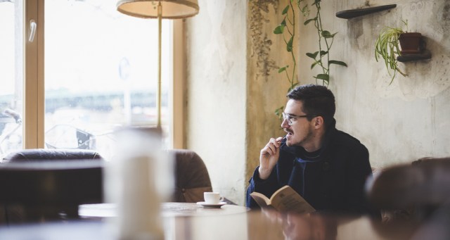 Man Pretending to Read “Gravity’s Rainbow” Envious of Man Pretending to Read “Infinite Jest”