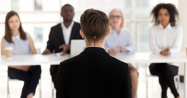 Rattail Artfully Tucked Into Collar for Interview