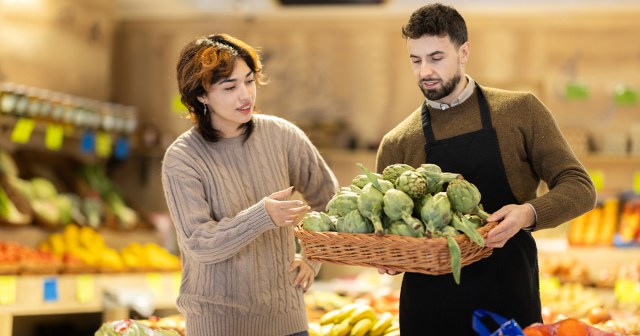 Person Comparing Artichokes in Produce Section Running on Pure Instinct
